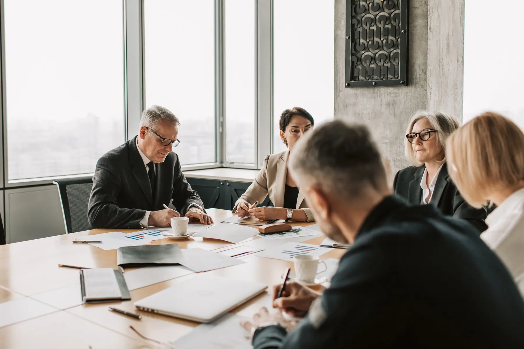 Executive team discussing performance in a conference room