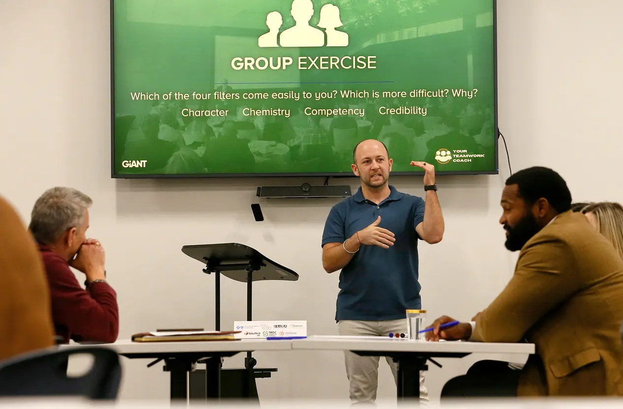 Ryan Mayfield facilitating a group exercise with a leadership team